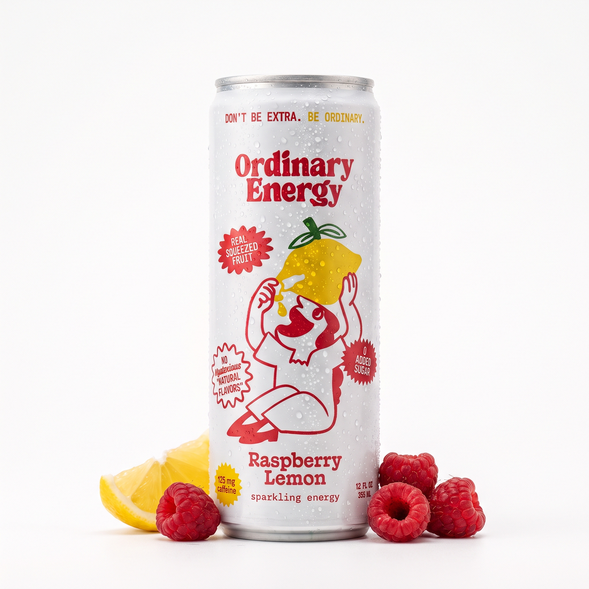 Ordinary Energy Raspberry Lemon sparkling energy drink can with fresh raspberries and lemon